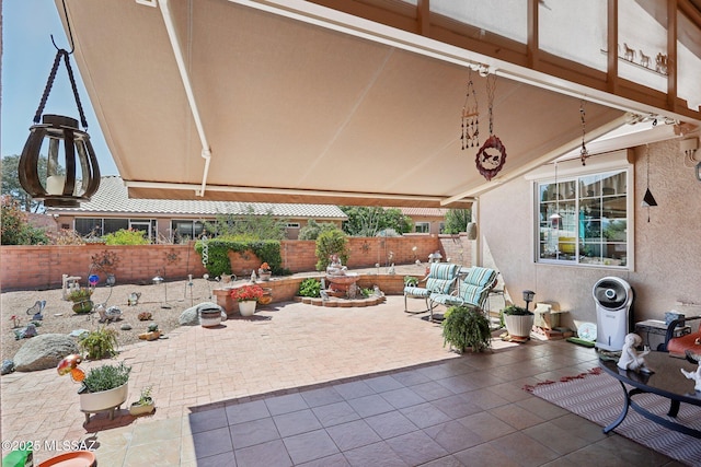 view of patio featuring fence