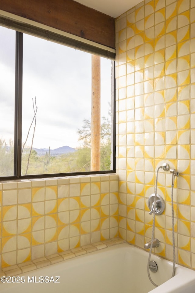 bathroom featuring a mountain view