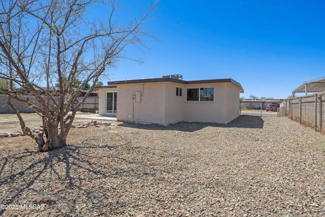 7575 E Apple Tree Dr, Tucson, AZ 85730 - back of property featuring stucco siding and a fenced backyard