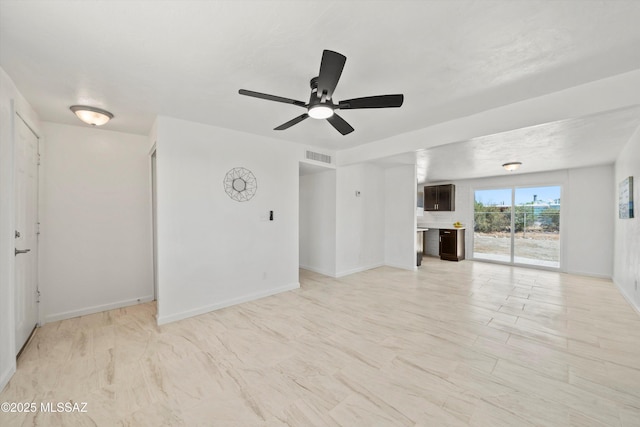 7575 E Apple Tree Dr, Tucson, AZ 85730 - unfurnished living room featuring ceiling fan and baseboards