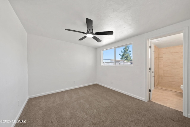 7575 E Apple Tree Dr, Tucson, AZ 85730 - unfurnished bedroom featuring carpet, baseboards, ensuite bath, and a ceiling fan