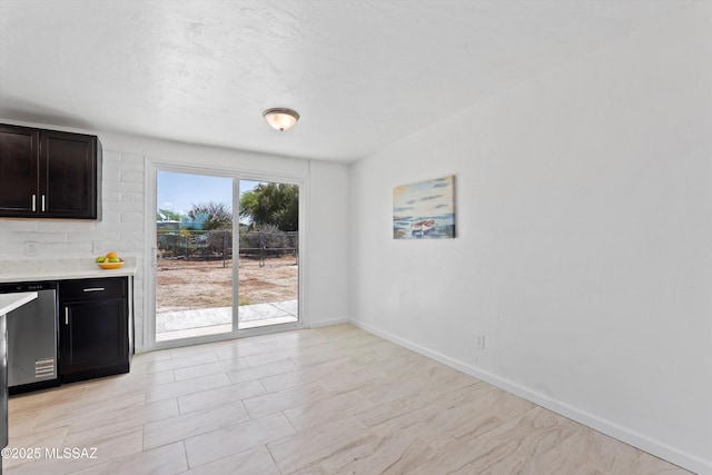7575 E Apple Tree Dr, Tucson, AZ 85730 - unfurnished dining area with baseboards