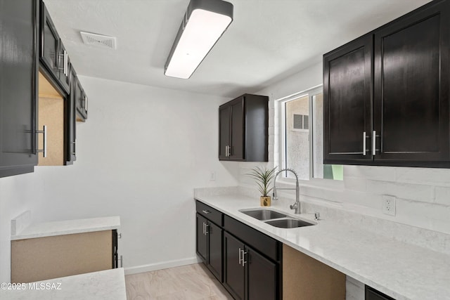 7575 E Apple Tree Dr, Tucson, AZ 85730 - kitchen with a sink, baseboards, and light countertops