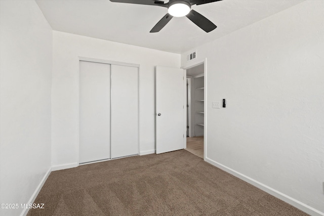 7575 E Apple Tree Dr, Tucson, AZ 85730 - unfurnished bedroom featuring carpet flooring, a closet, baseboards, and a ceiling fan