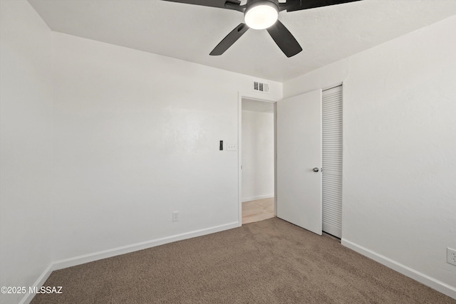 7575 E Apple Tree Dr, Tucson, AZ 85730 - unfurnished bedroom with carpet floors, baseboards, a closet, and a ceiling fan