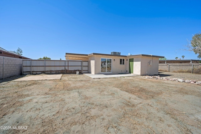 7575 E Apple Tree Dr, Tucson, AZ 85730 - rear view of property featuring stucco siding and a patio