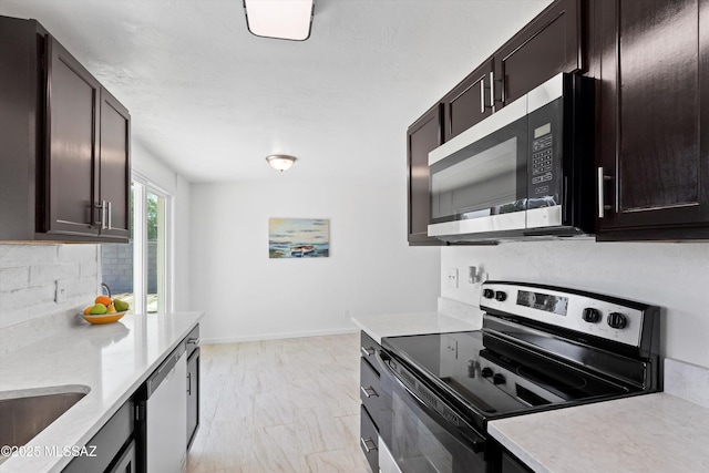 7575 E Apple Tree Dr, Tucson, AZ 85730 - kitchen with stainless steel appliances, light countertops, dark brown cabinets, and decorative backsplash