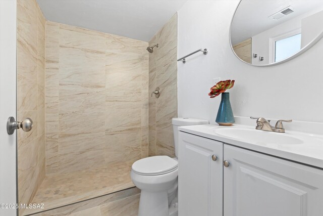 7575 E Apple Tree Dr, Tucson, AZ 85730 - full bathroom featuring vanity, toilet, and tiled shower
