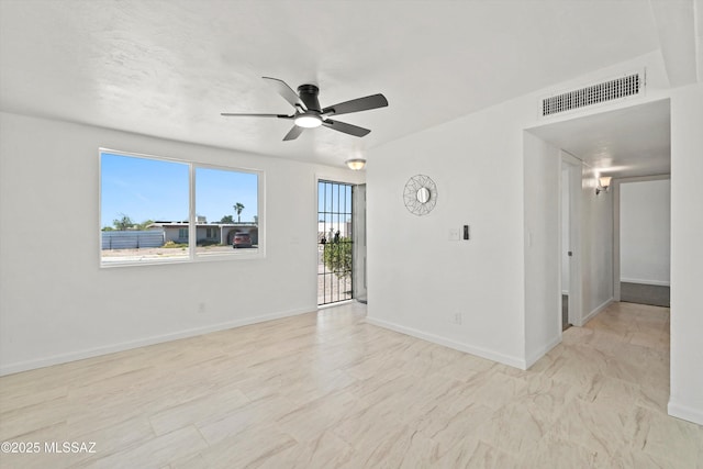 7575 E Apple Tree Dr, Tucson, AZ 85730 - unfurnished room with a ceiling fan and baseboards