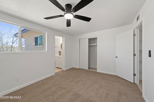 7575 E Apple Tree Dr, Tucson, AZ 85730 - unfurnished bedroom with light colored carpet, a closet, connected bathroom, and baseboards