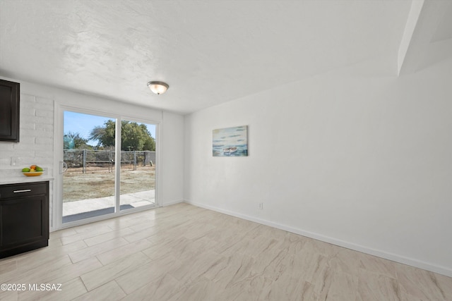 7575 E Apple Tree Dr, Tucson, AZ 85730 - spare room featuring baseboards