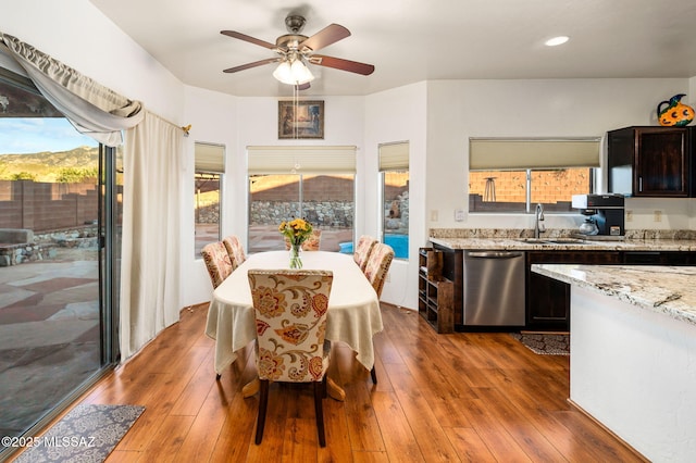 dining space featuring ceiling fan and hardwood / wood-style floors