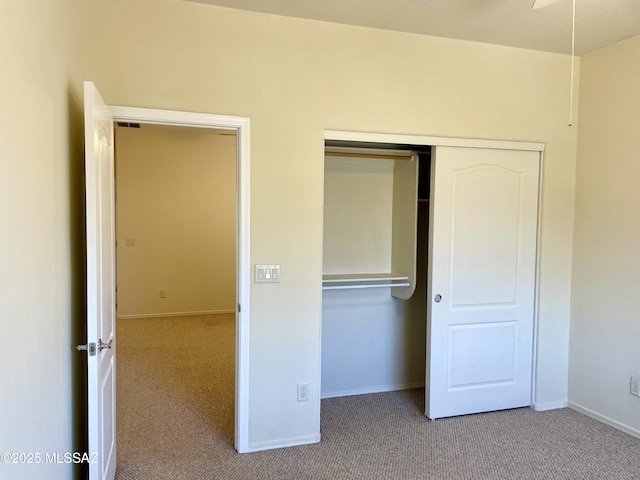 13978 N Big Wash Overlook Pl, Tucson, AZ 85739 - unfurnished bedroom featuring carpet flooring, a closet, and baseboards