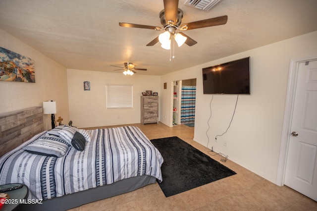 bedroom with a ceiling fan and visible vents