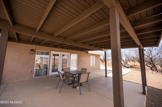 view of patio featuring outdoor dining space and french doors