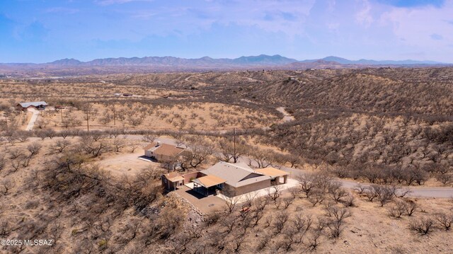 birds eye view of property with a desert view and a mountain view