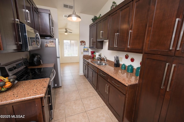 kitchen with light tile patterned floors, a ceiling fan, visible vents, a sink, and stainless steel appliances
