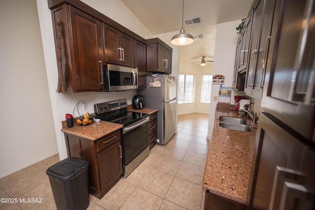 kitchen featuring visible vents, a sink, ceiling fan, stainless steel appliances, and dark brown cabinets