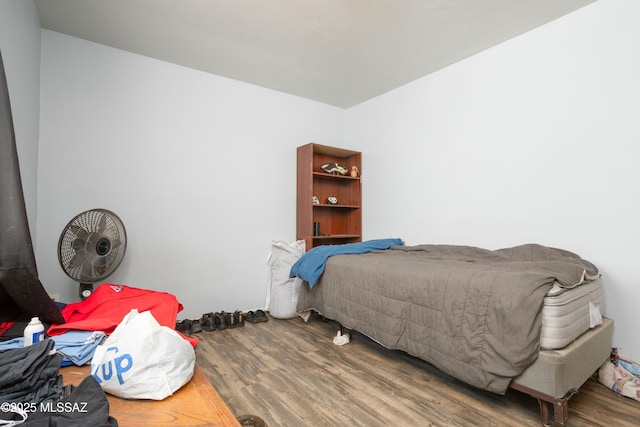 bedroom featuring wood finished floors