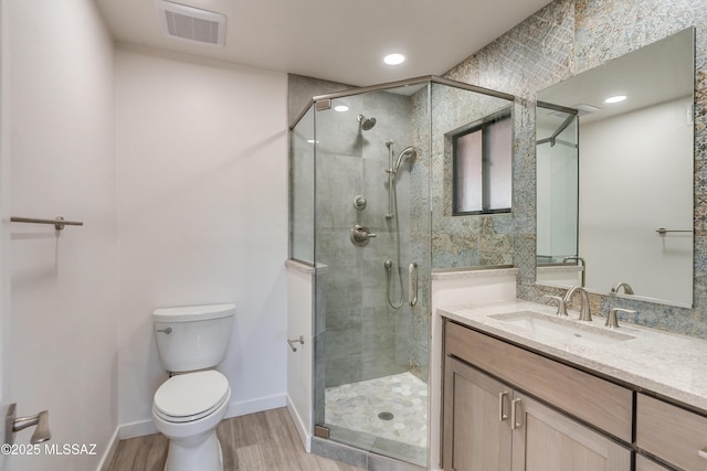 3053 W Lobo Rd, Tucson, AZ 85742 - full bath with toilet, wood finished floors, visible vents, and a stall shower