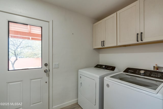 3053 W Lobo Rd, Tucson, AZ 85742 - laundry room with cabinet space, baseboards, and washer and clothes dryer