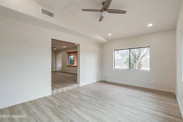3053 W Lobo Rd, Tucson, AZ 85742 - spare room with light wood finished floors, visible vents, baseboards, ceiling fan, and vaulted ceiling