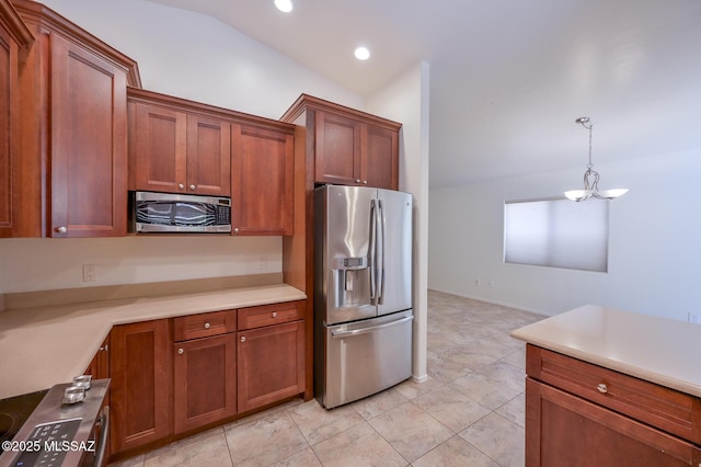 kitchen featuring lofted ceiling, stainless steel appliances, light countertops, pendant lighting, and brown cabinets