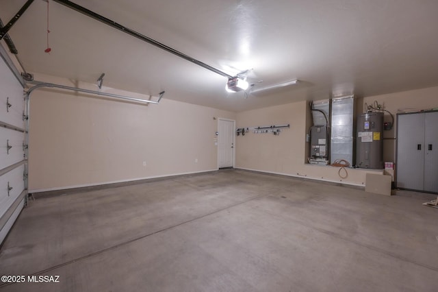 garage featuring water heater, a garage door opener, and baseboards