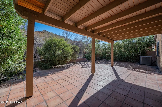 view of patio / terrace with cooling unit and a fenced backyard