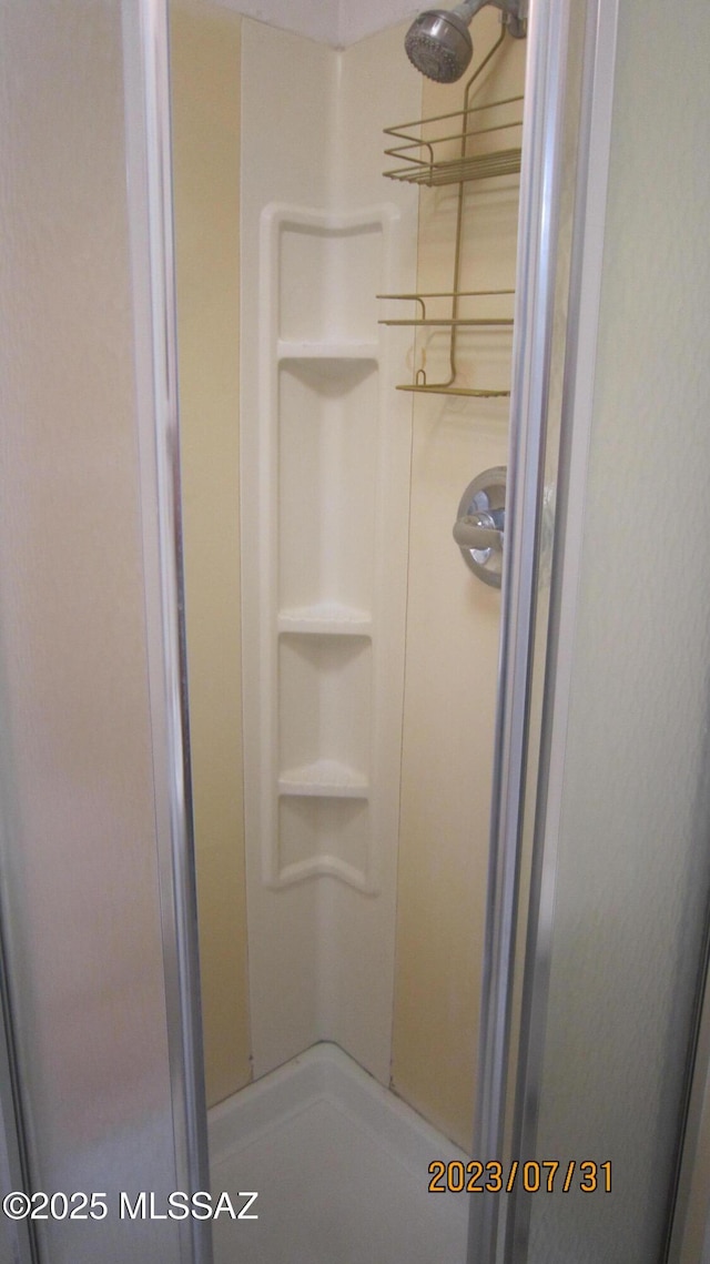 interior space with a shower stall