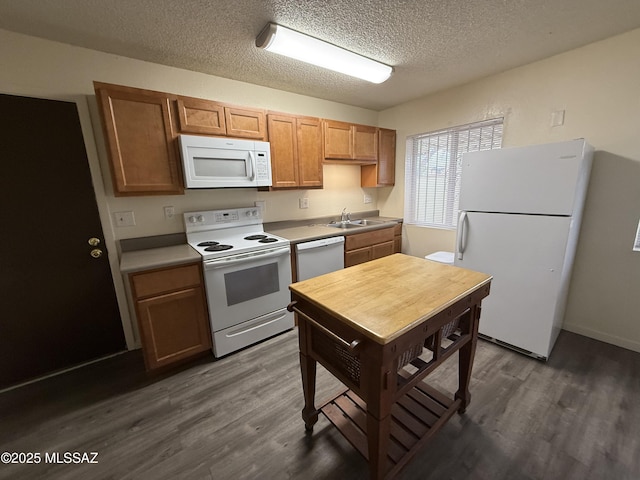 1419 E Linden St, Tucson, AZ 85719 - kitchen featuring white appliances, dark wood finished floors, a textured ceiling, and light countertops