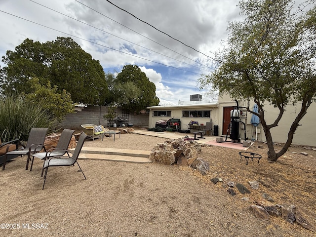 view of yard with fence and a patio area