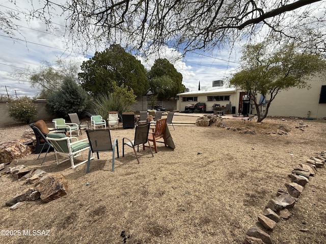 view of yard featuring a patio area and fence