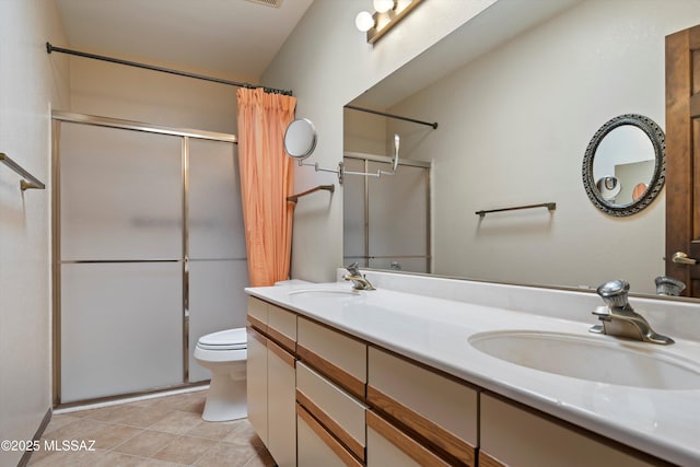 full bath featuring a sink, a shower with shower curtain, double vanity, and tile patterned flooring