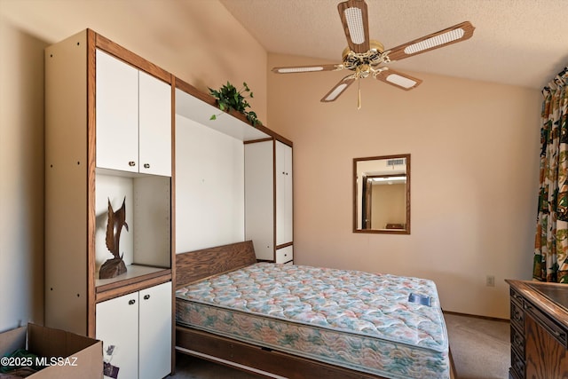 bedroom featuring lofted ceiling, light colored carpet, and a textured ceiling