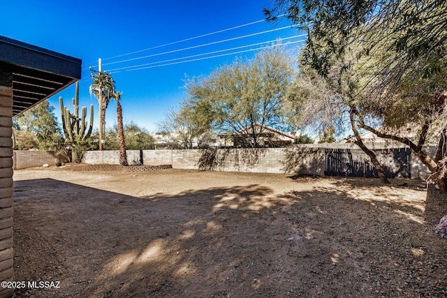 view of yard with a fenced backyard