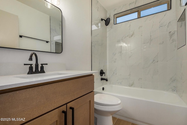 bathroom featuring vanity, toilet, and shower / washtub combination