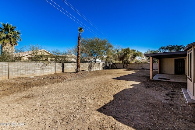 view of yard featuring a patio and a fenced backyard