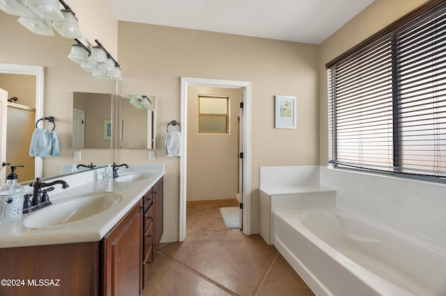 full bathroom featuring double vanity, a sink, a garden tub, and a shower stall