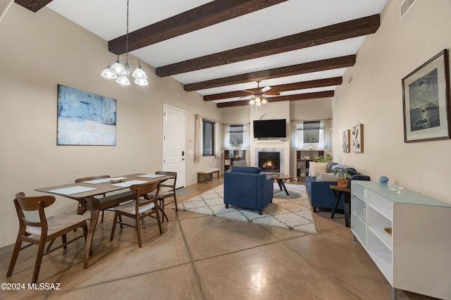 dining space featuring visible vents, concrete floors, ceiling fan, beam ceiling, and a lit fireplace