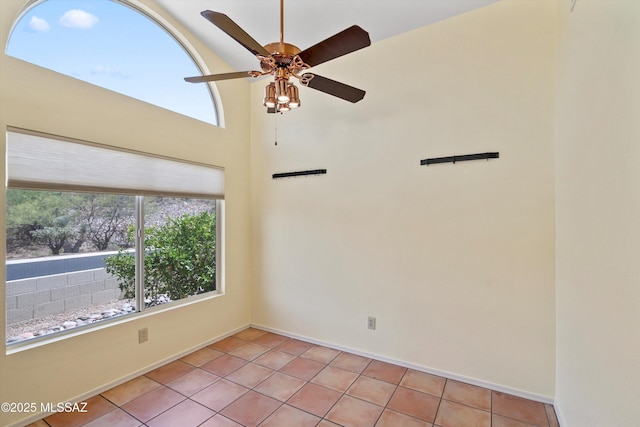 36973 S Highland Ridge Ct, Tucson, AZ 85739 - spare room with ceiling fan, light tile patterned floors, and baseboards
