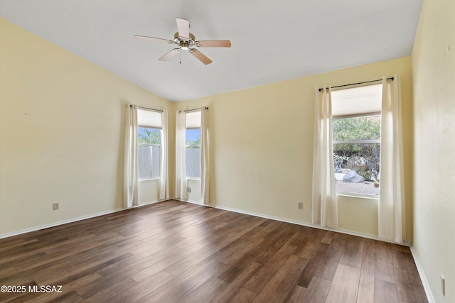 36973 S Highland Ridge Ct, Tucson, AZ 85739 - empty room featuring dark wood-style flooring, plenty of natural light, ceiling fan, and baseboards
