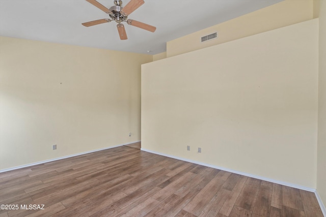 36973 S Highland Ridge Ct, Tucson, AZ 85739 - unfurnished room with light wood-style floors, baseboards, and a ceiling fan