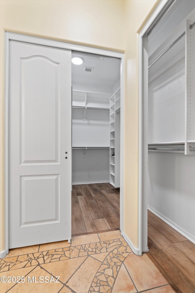 36973 S Highland Ridge Ct, Tucson, AZ 85739 - walk in closet with light wood finished floors