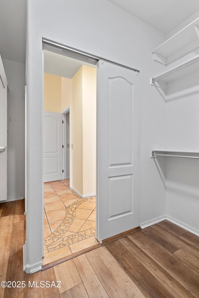 36973 S Highland Ridge Ct, Tucson, AZ 85739 - walk in closet featuring hardwood / wood-style floors