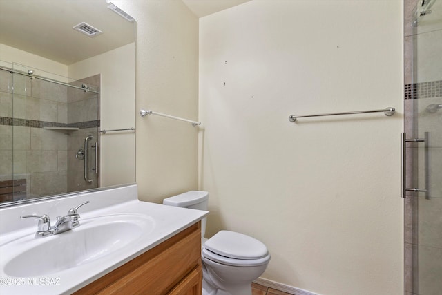 36973 S Highland Ridge Ct, Tucson, AZ 85739 - bathroom featuring a stall shower, vanity, and toilet