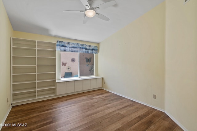 36973 S Highland Ridge Ct, Tucson, AZ 85739 - empty room featuring wood finished floors, ceiling fan, and baseboards