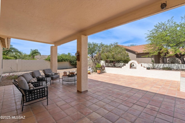 36973 S Highland Ridge Ct, Tucson, AZ 85739 - fenced backyard featuring a patio and an outdoor hangout area