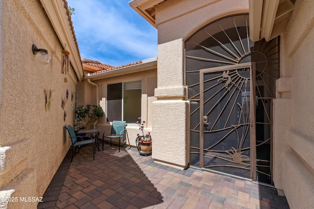 36973 S Highland Ridge Ct, Tucson, AZ 85739 - doorway to property featuring a patio and stucco siding