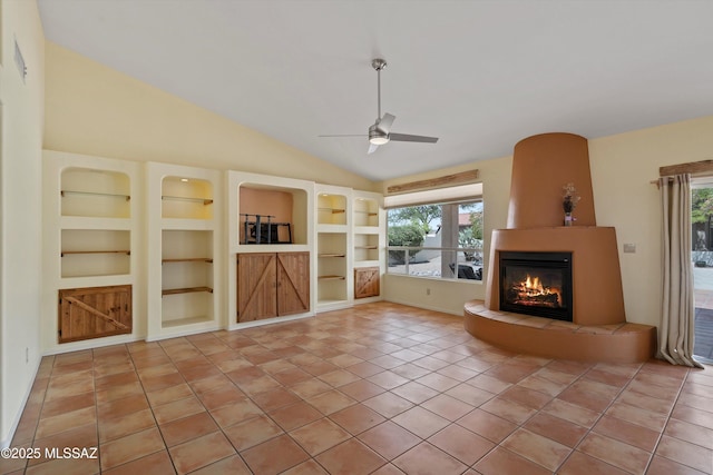 36973 S Highland Ridge Ct, Tucson, AZ 85739 - unfurnished living room with a large fireplace, a ceiling fan, healthy amount of natural light, built in features, and lofted ceiling
